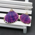 Macro detail of gradient purple shell charms with gold plated edges for DIY jewelry making - Purple To Blue Gradient