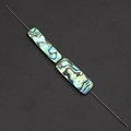 Macro shot of rectangular abalone shell beads with natural iridescent texture and colors - Rectangle 7x25mm