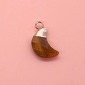 Macro detail of crescent moon tiger eye stone pendant with rose gold plated clasp - Tiger's Eye