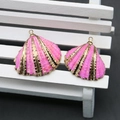 Close-up of pink scallop shell charms with gold plating for DIY jewelry making - Hot Pink