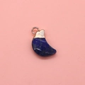 Macro detail of crescent moon blue turquoise pendant with faceted finish and gold clasp - Lapis Lazuli