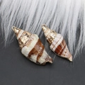 Macro detail of natural shell pendants with gold-plated edges and metal loops for DIY jewelry - Style 25