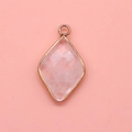 Macro detail of diamond-shaped pink quartz pendant with gold plated metal border - 15x26mm / White Crystal