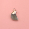 Macro detail of moon shaped grey faceted stone pendant with golden plated metal cap - Green Aventurine