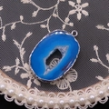 Detail showing blue agate geode pendant with silver electroplated edges and crystal core - Royal Blue (#6)