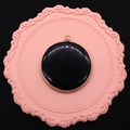 Polished black gemstone disc pendant with gold plated rim and top bail connector - Black Agate
