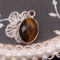 Faceted oval tiger eye gemstone pendant with golden metal loop for jewelry making - 11x19mm / Tiger's Eye