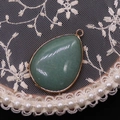 Waterdrop shaped light green natural stone pendant with a gold plated metal frame - Green Aventurine