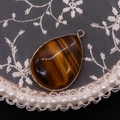 Tiger eye stone teardrop pendant with gold plating and metallic trim for DIY jewelry - Tiger's Eye
