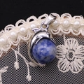Dolphin pendant necklace with blue sodalite crystal stone and silver-tone metal finish - 14x23mm / Blue Spot Stone