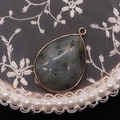 Waterdrop-shaped grey labradorite stone pendant with gold-plated metal edges on lace - Labradorite