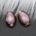 Natural purple cowrie shell pendant with golden metal bail and edge detail - Style 51
