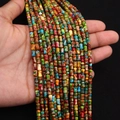 Vue macro de perles en pierre impériale colorées de 4x6mm pour la création de bijoux - 4x6MM / Couleur Arc-en-ciel