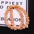 Macro shot of orange five-petal flower natural stone loose beads for DIY jewelry making - 10x10x4mm / No.11 (Orange Pink)