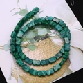 Close-up of turquoise-style bow-tie beads with natural texture for DIY jewelry making - Turquoise