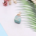 Light blue natural stone pendant with gold plating on a minimalist palm leaf background - Sky Blue (No.2)