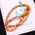 Macro view of orange heart-shaped natural imperial stone beads for DIY jewelry making - 1 Piece / Orange-Yellow (No.11)