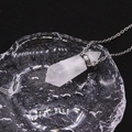 White crystal hexagonal pillar perfume bottle necklace with silver chain on water surface - White Crystal