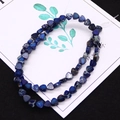 Macro shot of blue imperial jasper triangle beads with natural textures and golden veins - 1 Piece / Dark Blue (No.8)