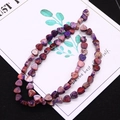 Detailed close-up of heart-shaped emperor stone beads in purple and magenta for DIY jewelry - 1 Piece / Purple (No. 7)