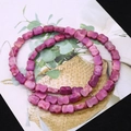 Magenta butterfly shaped stone beads for DIY jewelry making on illustrative background - Fuschia