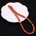 Macro detail of 8x10mm orange imperial jasper drum beads with natural marble texture - Barrel Beads / No. 4 (Orange Red)