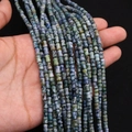 Détail macro de perles en pierre empereur en forme d'os aux textures marbrées pour bijoux DIY - 4x6MM / Mélange Panaché