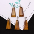 Detailed view of trapezoid cut tiger eye pendants with polished texture and silver bails - Trapezoid Pendant Set / Tiger's Eye