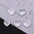 Macro shot of clear heart-shaped faceted crystal beads for DIY jewelry making - White Crystal