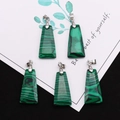 Detail of five trapezoid malachite pendants with silver bails on a decorative background - Trapezoid Pendant Set / Malachite