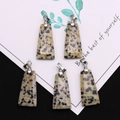 Polished trapezoid Dalmatian Jasper stone pendants with silver bails on a decorative card - Trapezoid Pendant Set / Dalmatian Jasper