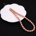 Pinkish brown 8x10mm natural stone drum beads on a white porcelain dish for DIY jewelry - Barrel Beads / No. 14 (Pink Brown)