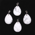 Macro view of teardrop white howlite stone pendants with natural grey veining detail - 18x25mm / Howlite