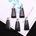 Detailed view of five black trapezoid stone pendants with silver clasps on card - Trapezoid Pendant Set / Black Agate