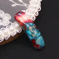 Macro detail of curved natural stone connector with red and blue marbled texture - Red Blue Pink Cracked (No. 5)
