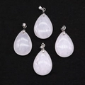 Waterdrop-shaped rose quartz stone pendants with silver metal clasps on black velvet - 18x25mm / White Jade