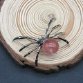 Detailed macro view of a vintage silver spider pendant featuring a pink quartz stone - 34x47mm / Watermelon Quartz
