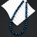 Detailed macro view of 10mm blue tiger eye round beads with silk luster for DIY jewelry - Dark Blue (No. 10)