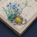 Scorpion pendant with yellow stone set in vintage silver metal frame on bamboo mat - Scorpion Shape (1065-T250515005) / Topaz