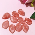 Close-up of teardrop-shaped pink natural stone beads with marble texture for DIY jewelry - 17x24mm / Watermelon Quartz