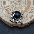Blue sandstone pendant featuring a silver dragon claw design on a wood background - 27x30mm (1065-T250515008) / Blue Sandstone