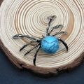 Vintage silver spider pendant featuring a turquoise stone inlay on a rustic wood base - 34x47mm / Blue Turquoise
