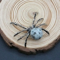 Silver spider pendant with grey marbled natural stone on a rustic wooden background - 34x47mm / Azurite