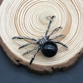 Vintage spider pendant with blue sandstone and silver metal legs on wood background - 34x47mm / Blue Sandstone