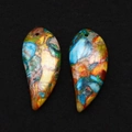 Macro shot of two crescent emperor stone pendants with colorful mottled mineral textures - 16x34mm / Style 4 (Blue Yellow Orange Red)