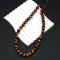 Polished yellow tiger eye round beads on a white wave display for DIY jewelry - 8mm / Yellow Brown (Style 2)