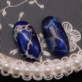 Vista macro de dos cabujones ovalados de jaspe imperial azul para joyería DIY - 12x25mm / Azul Oscuro (Nº2)