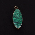 Macro view of marquise-shaped malachite pendant with electroplated gold edge and ring - Malachite