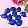 Detailed macro view of polished teardrop lapis lazuli stones for DIY jewelry making - 17x24mm / Lapis Lazuli