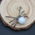 Silver spider pendant with large white pearl inlay on natural wood grain background - 34x47mm / White Stone (No. 31)